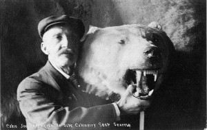 1913 postcard depicting J. E. Standley posing with a polar bear rug.