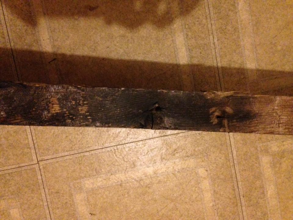 charred support beam in the basement of the indiana monroe house